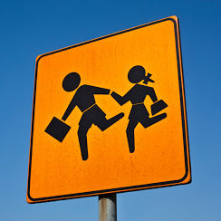 Children road sign against blue sky.