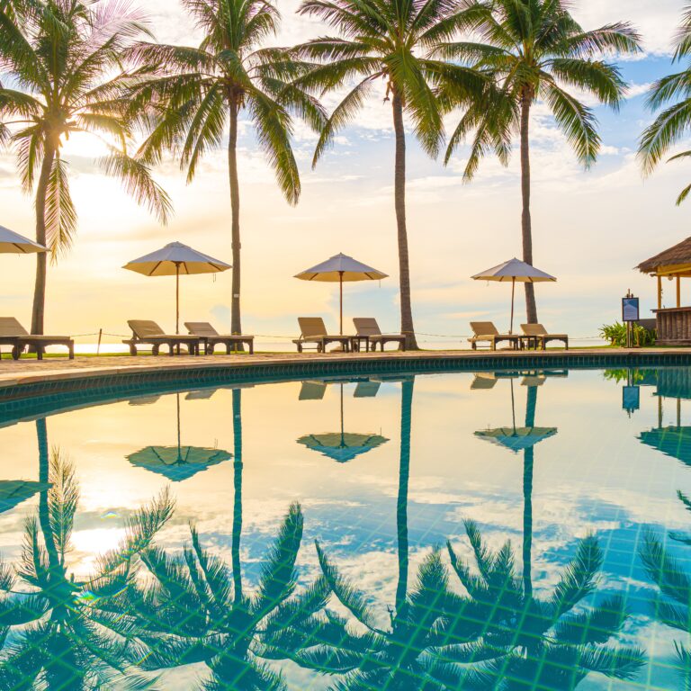 Beautiful luxury umbrella and chair around outdoor swimming pool beautiful swimming pool